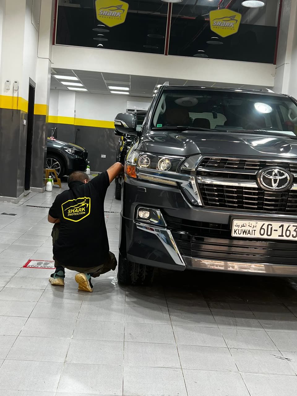 Technician prepping a Toyota Land Cruiser 200