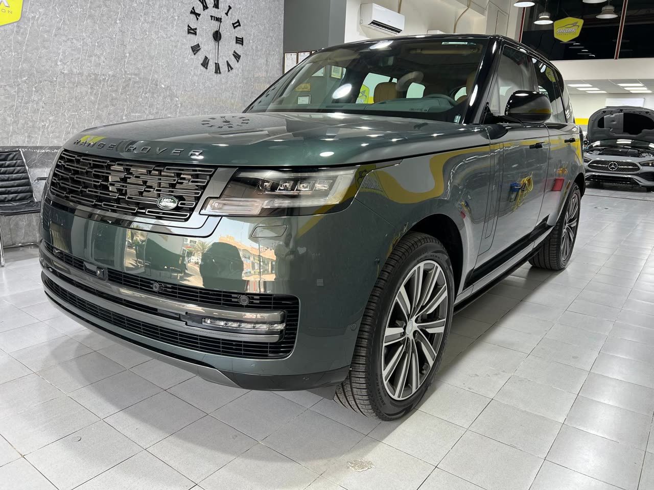 Green Range Rover in the Shark Protection KW showroom